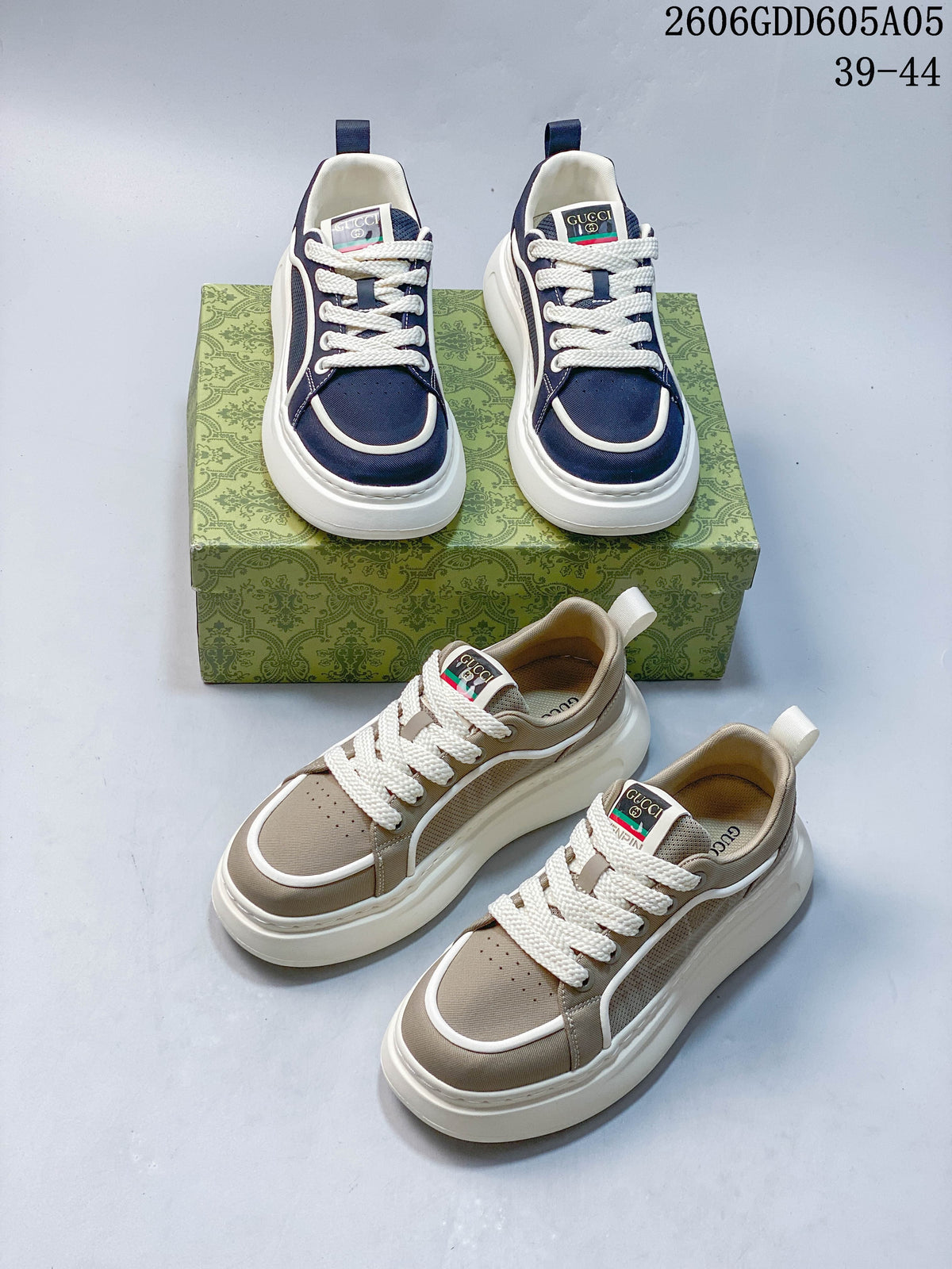 Navy and beige sneaker pairs shown together from above on patterned boxes.