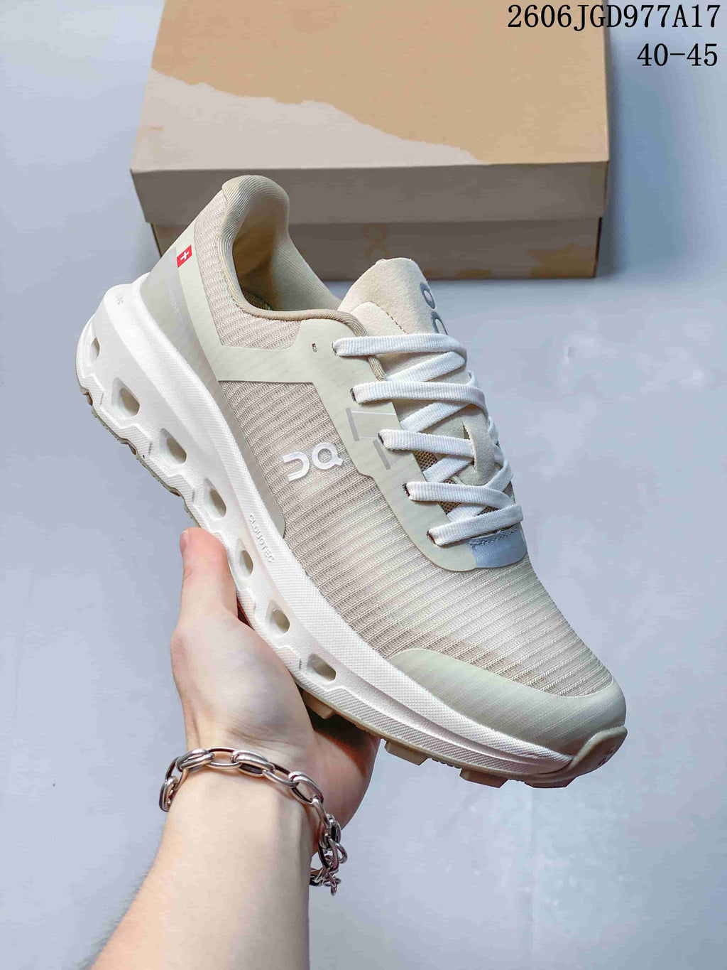 Angled side view of the beige On Cloudvista 2 shoe.