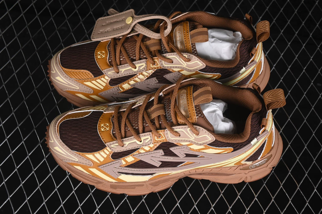 Angled top view showing the paired sneakers, layered side panels, dark mesh and padded collars.