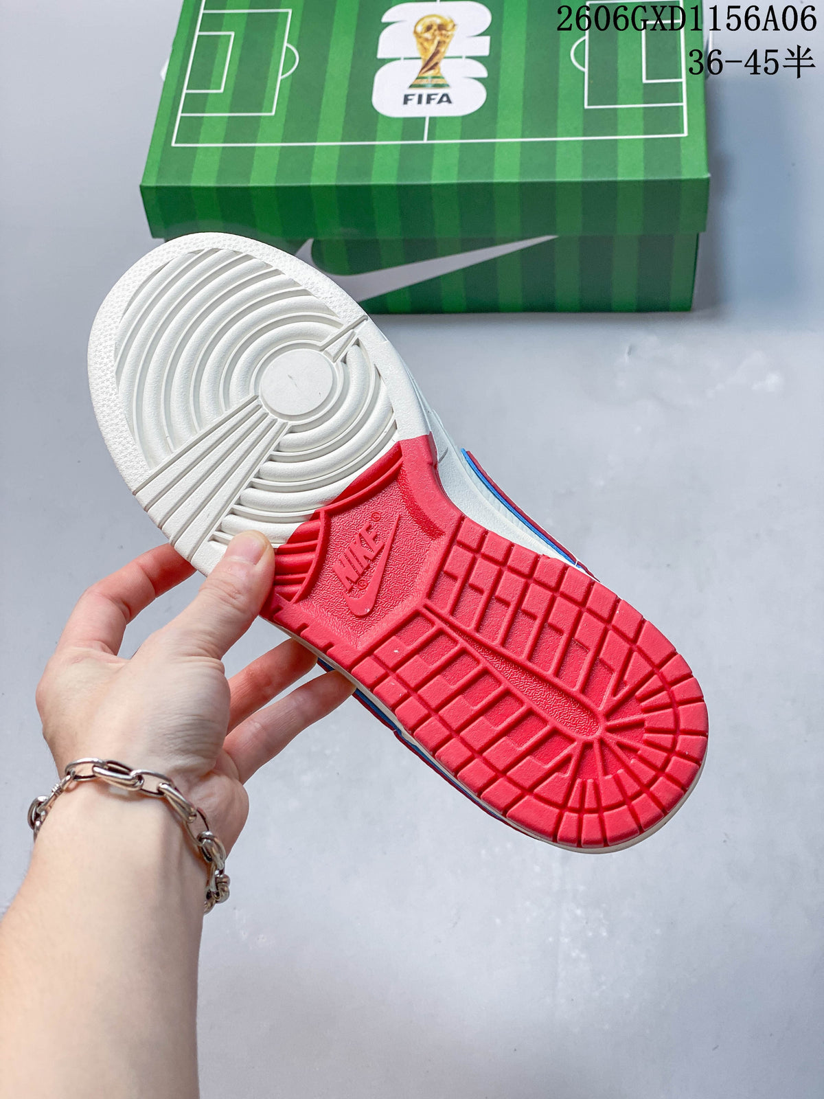 View of the sneaker outsole, showing a light-colored forefoot and red tread beneath the heel.