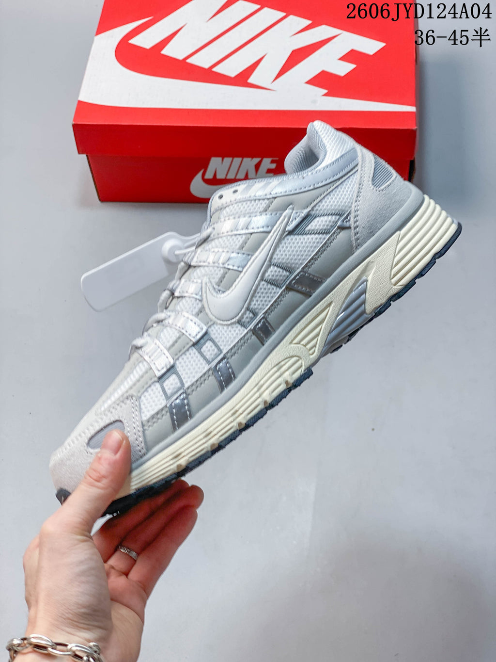Side view of the light gray and white Nike P-6000 sneaker