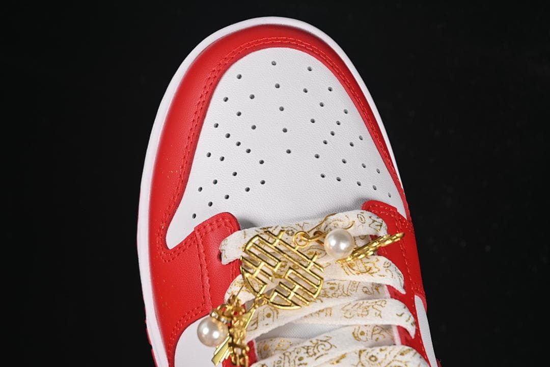 Top view of the perforated white toe and decorative laces