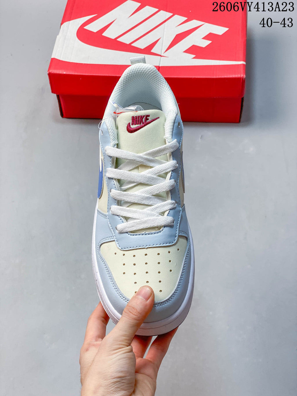 Top view of a NikeCourt Borough 2 Low sneaker with white laces and a perforated toe