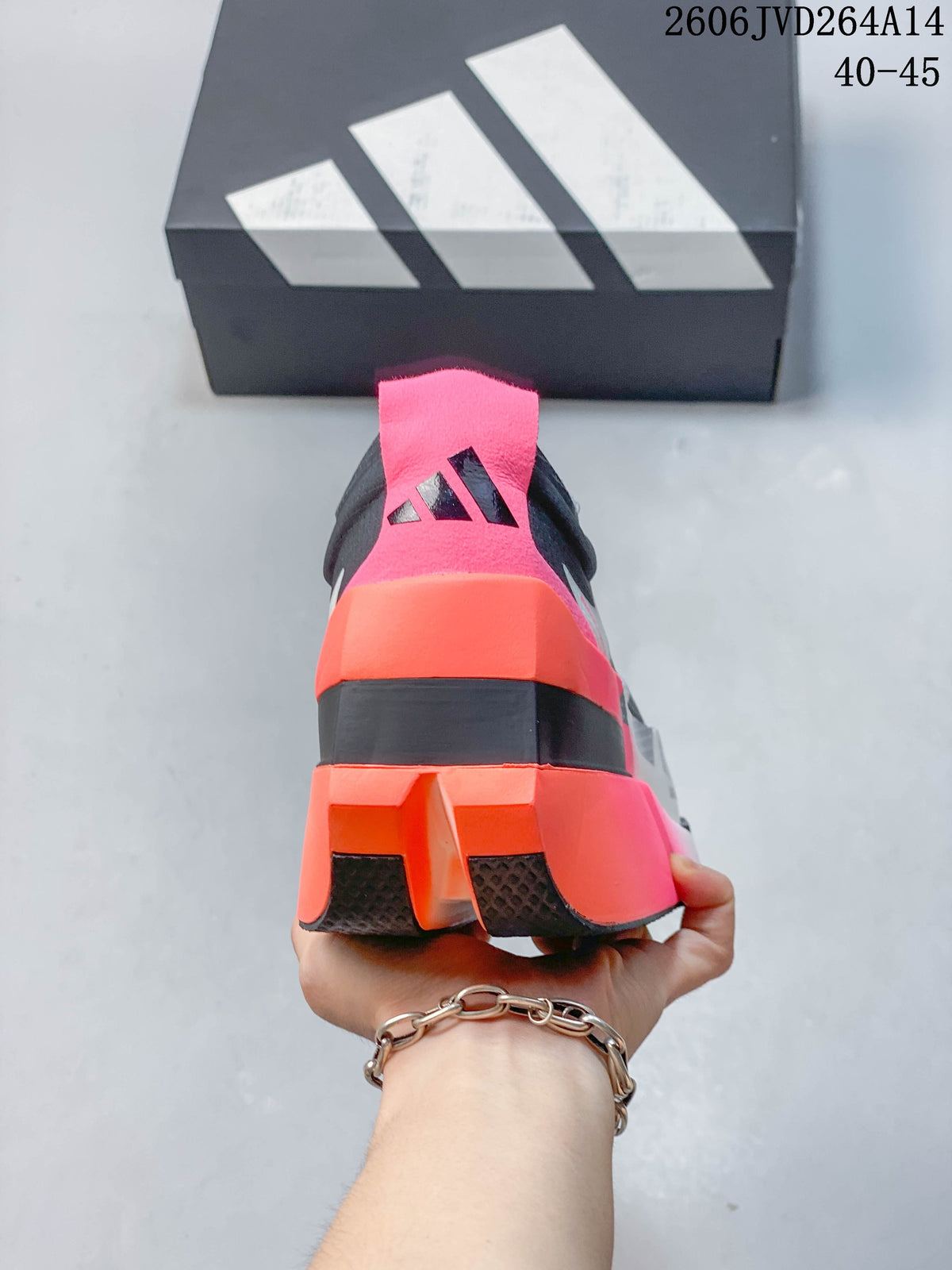Rear view showing the shoe’s pink and orange heel details and outsole.