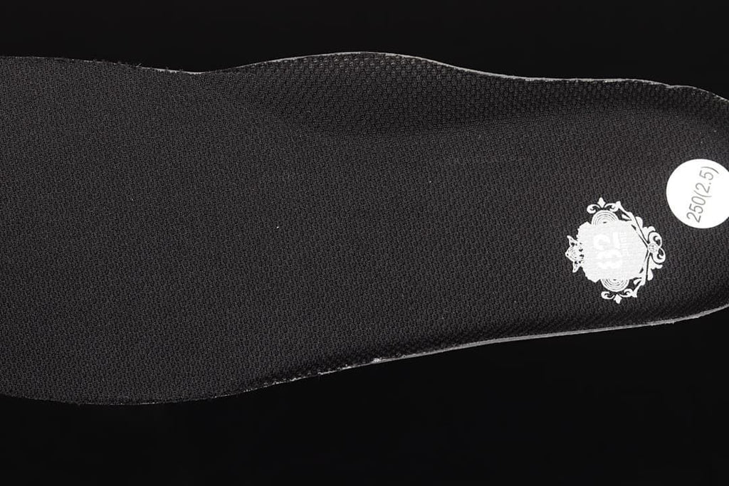 Close-up of the black insole with a size sticker.