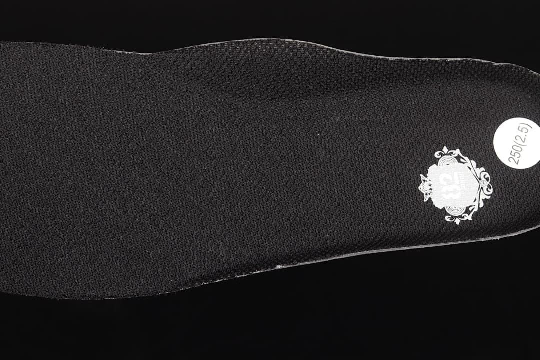 Close-up of the black insole with a size sticker.