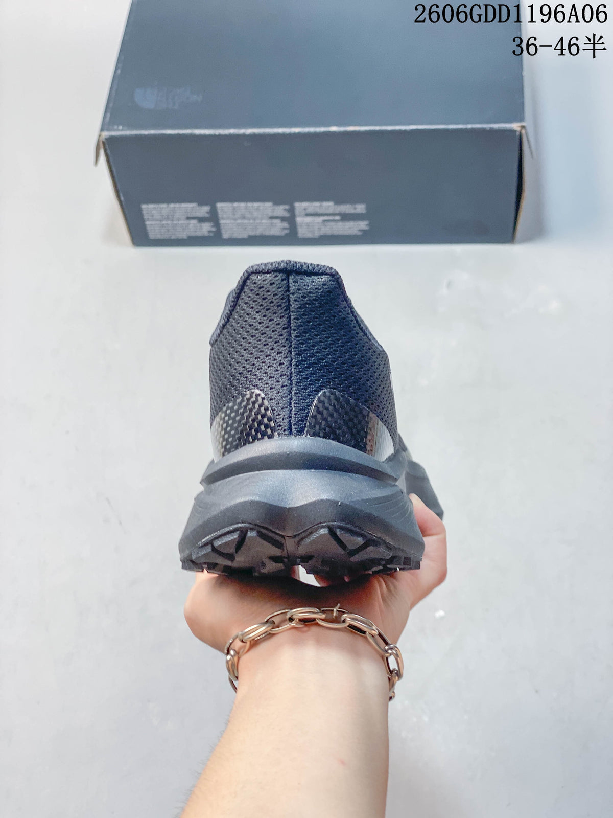 Rear view showing the heel and outsole of a gray trail shoe