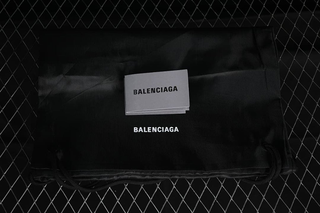 Black Balenciaga-branded fabric bag and cards