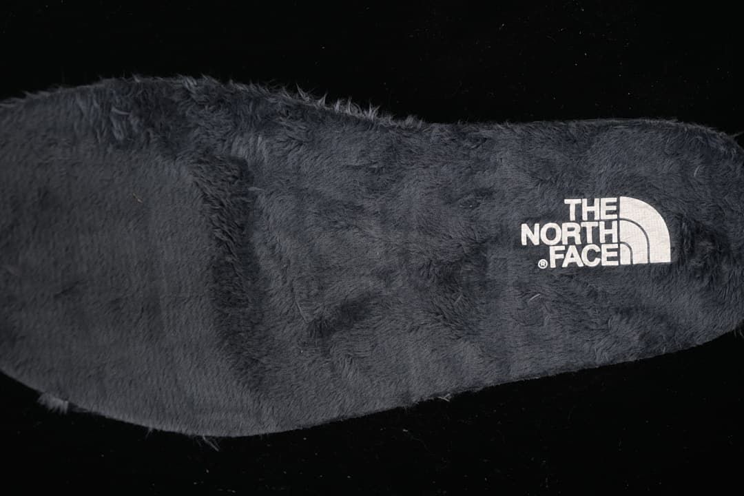 Close-up of the plush-looking dark interior lining and logo