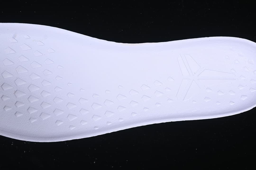 Close-up of the textured white shoe surface