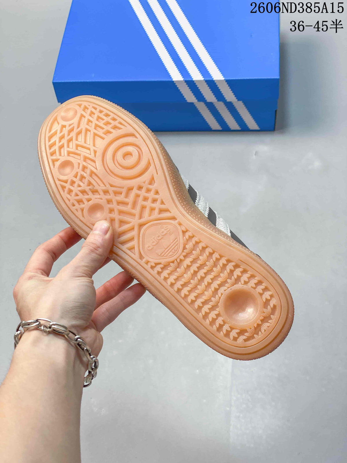 Close-up of the gum-colored sole and patterned tread on an adidas Spezial sneaker.