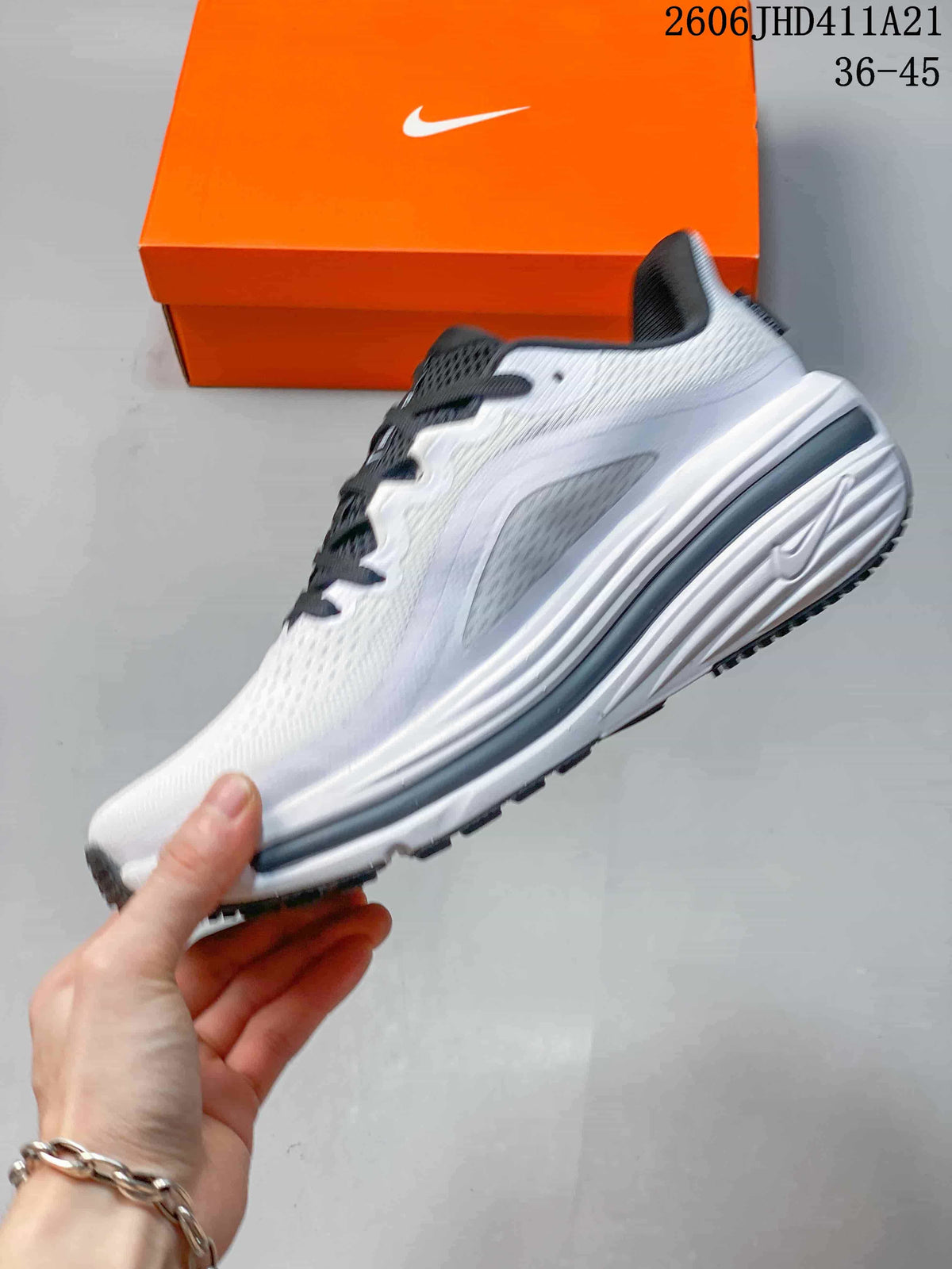 Side profile of a white Nike Air Zoom Winflo 12 running shoe with dark accents