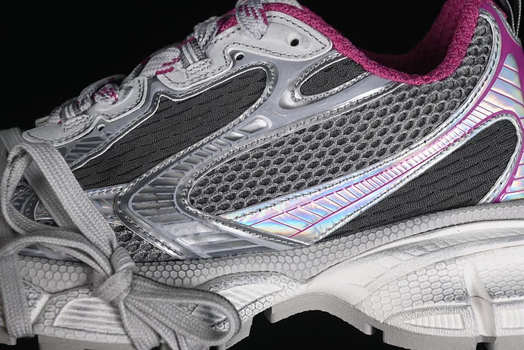 Close-up of the sneaker side showing mesh panels, layered details and laces