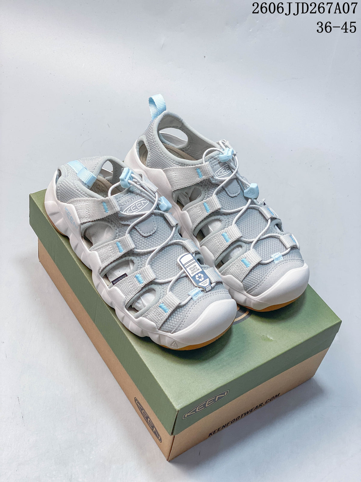 Pair of gray and light blue KEEN Astoria West closed-toe sandals on a shoebox