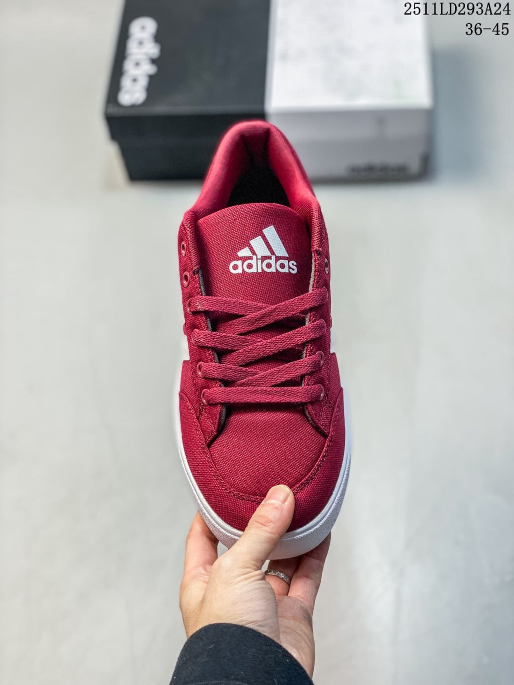 Front view of the burgundy lace-up sneaker with a white tongue logo