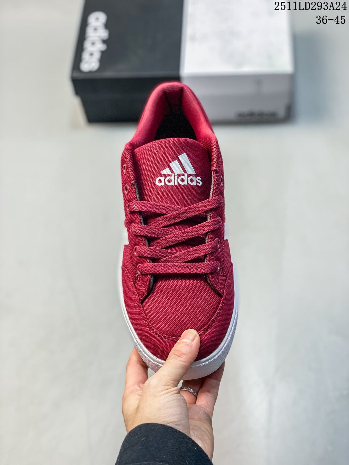 Front view of the burgundy lace-up sneaker with a white tongue logo