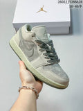 Gray and green Air Jordan 1 Low sneaker shown from the side with its shoe box.