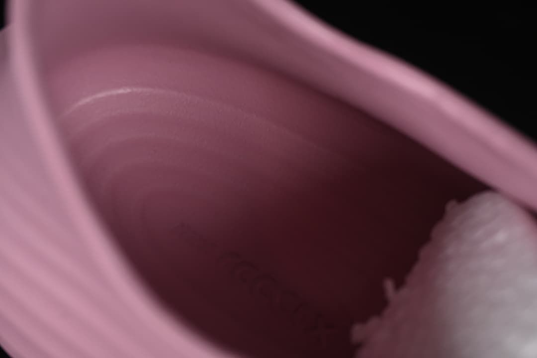 Close-up view inside the pink slip-on shoe.