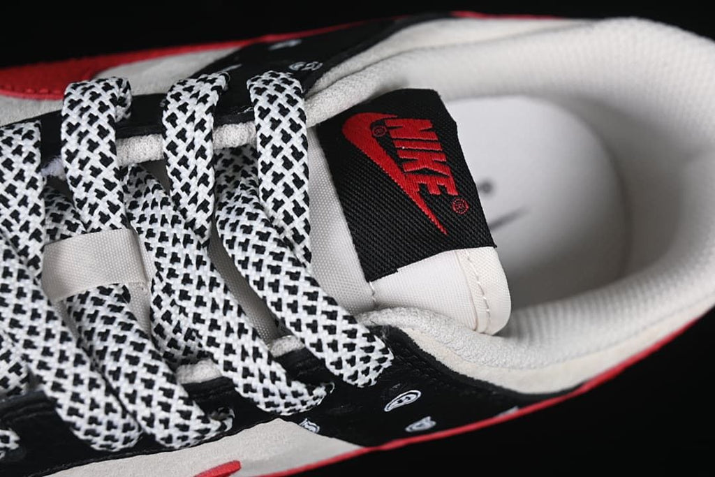 Close-up of the tongue label, padded collar, and patterned laces.