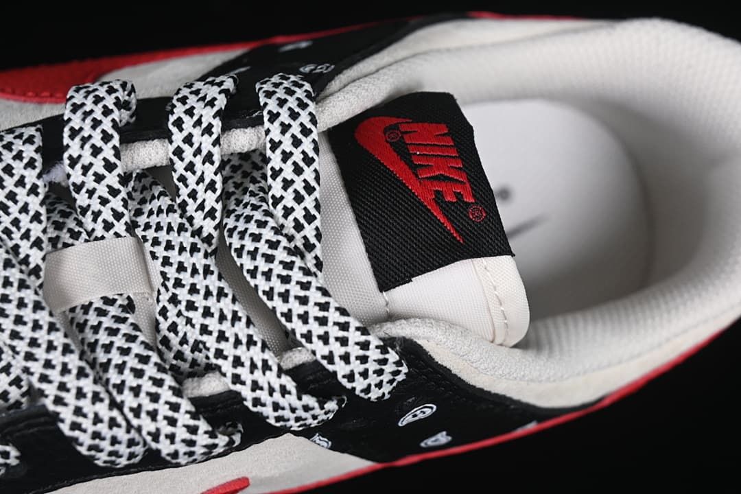 Close-up of the tongue label, padded collar, and patterned laces.