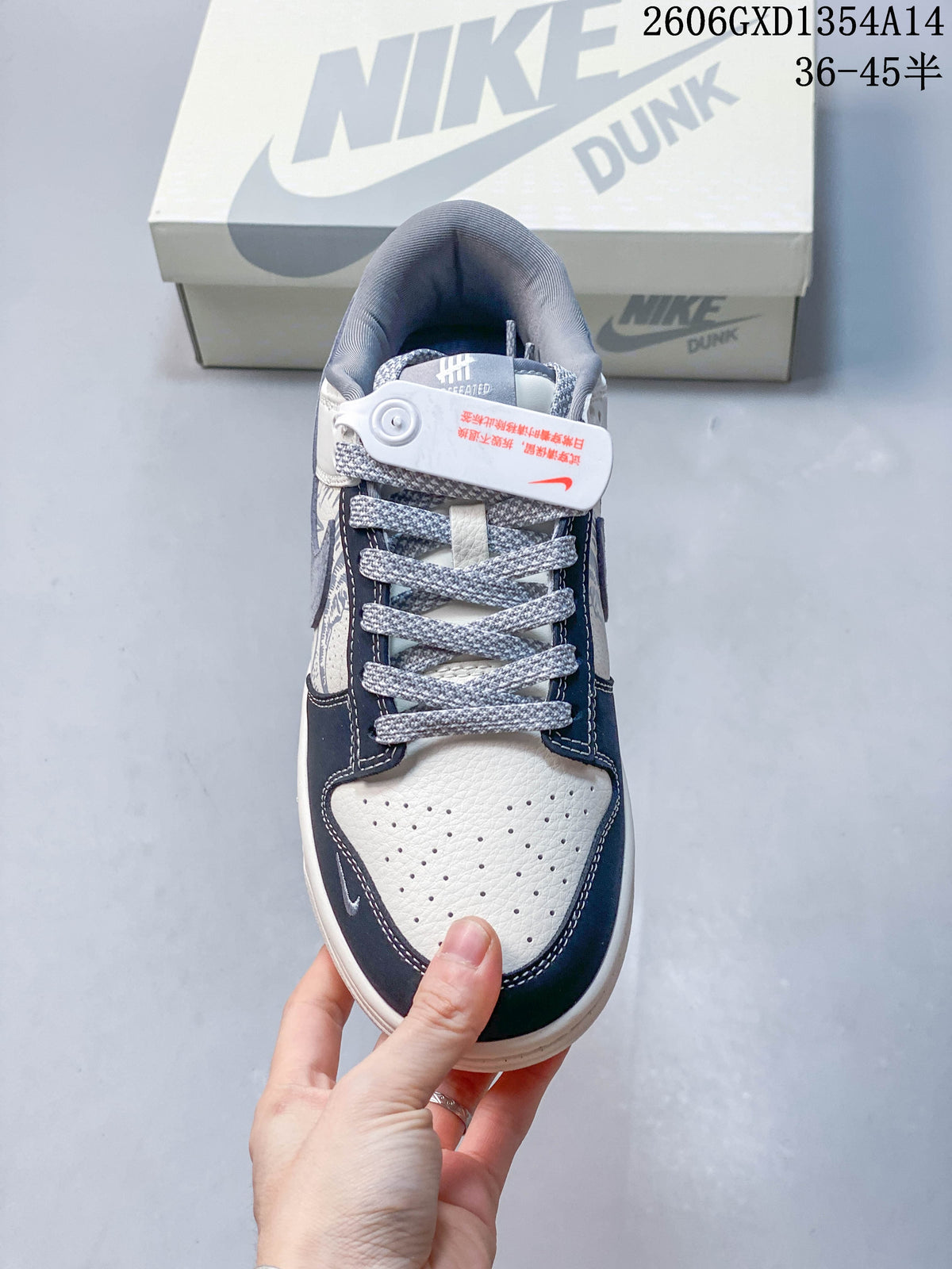 Front view showing perforated toe panels and textured gray laces