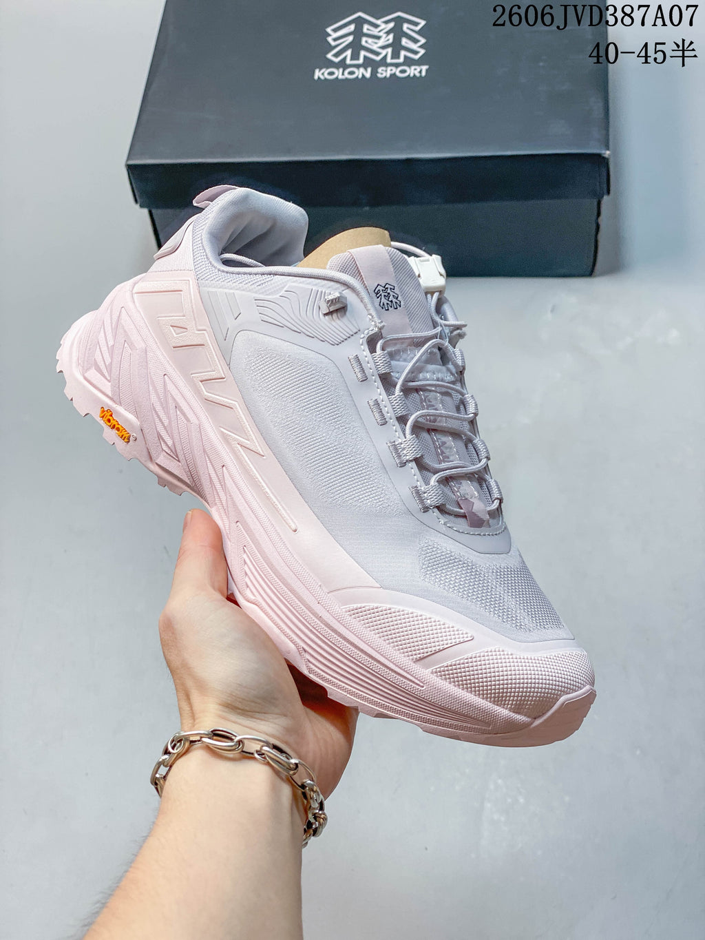 Angled side view of a Kolon Sport low-top sneaker