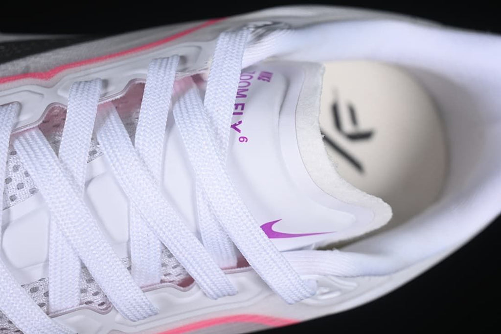 Top-down detail of laces, tongue, and shoe interior