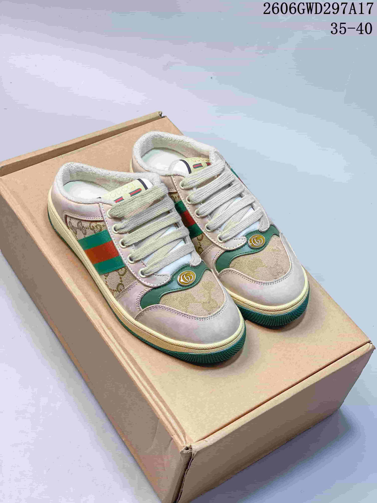 Pair of beige and brown patterned Gucci Screener-style mule sneakers with green and red side stripes