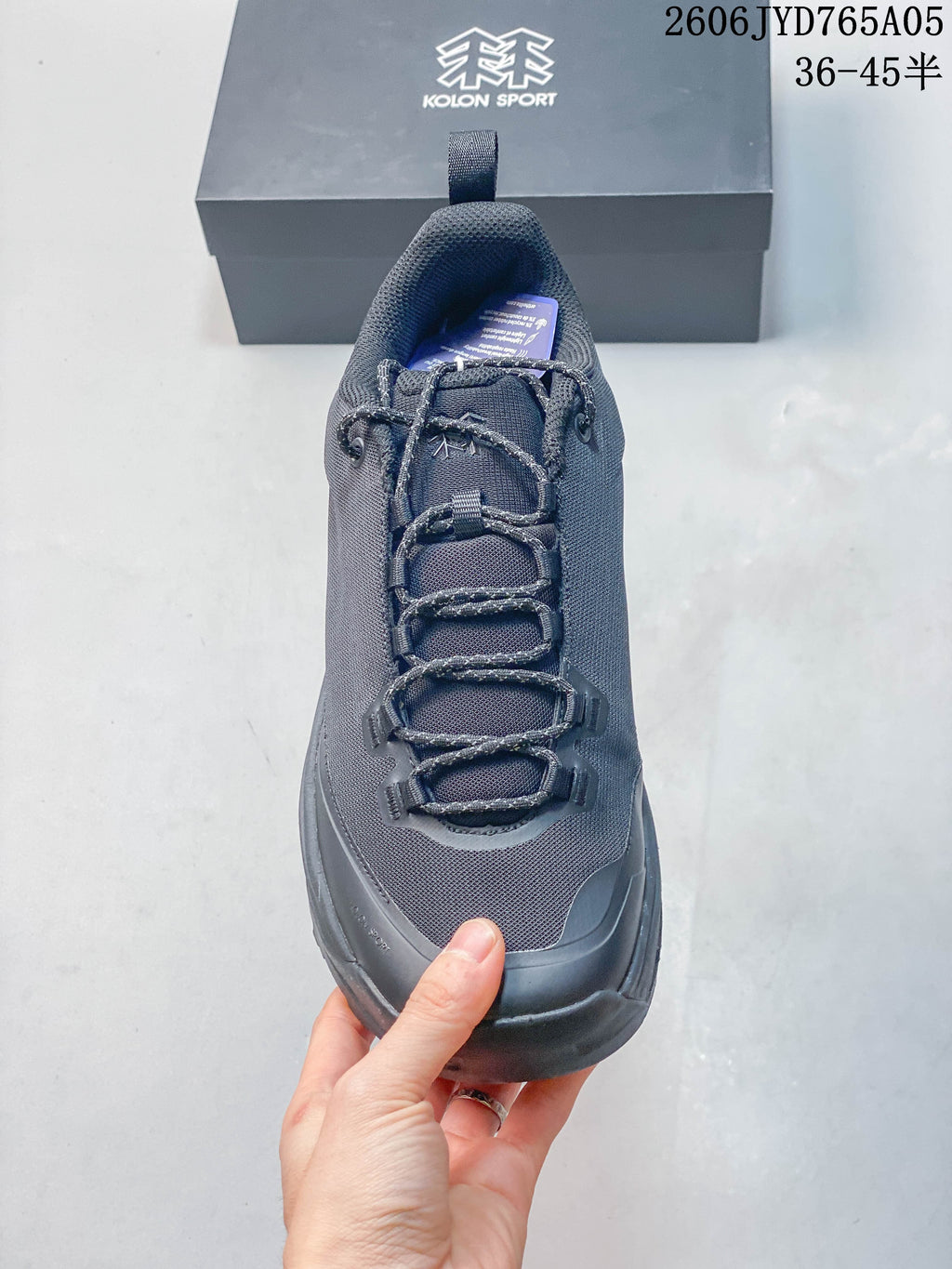 Front view of the hiking shoe showing its laces, tongue and toe area