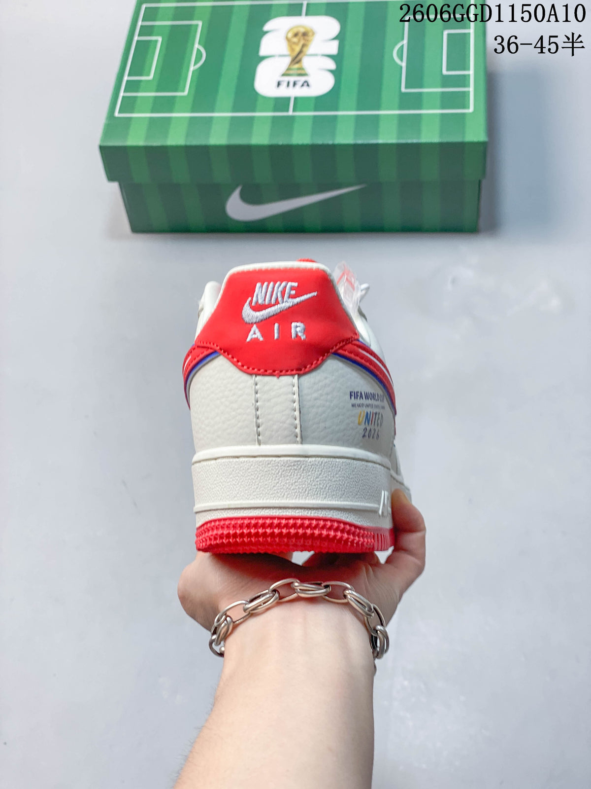 Rear view showing the red heel tab and football-themed graphics