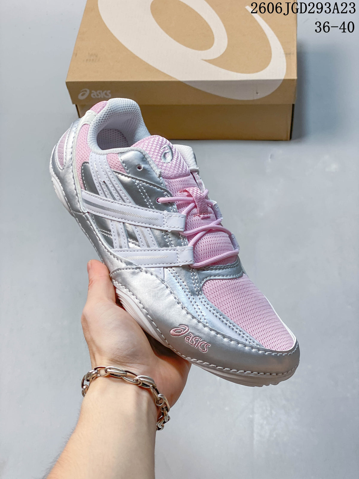 Pink, silver, and white ASICS Gel-Pickax sneaker with a mesh upper.