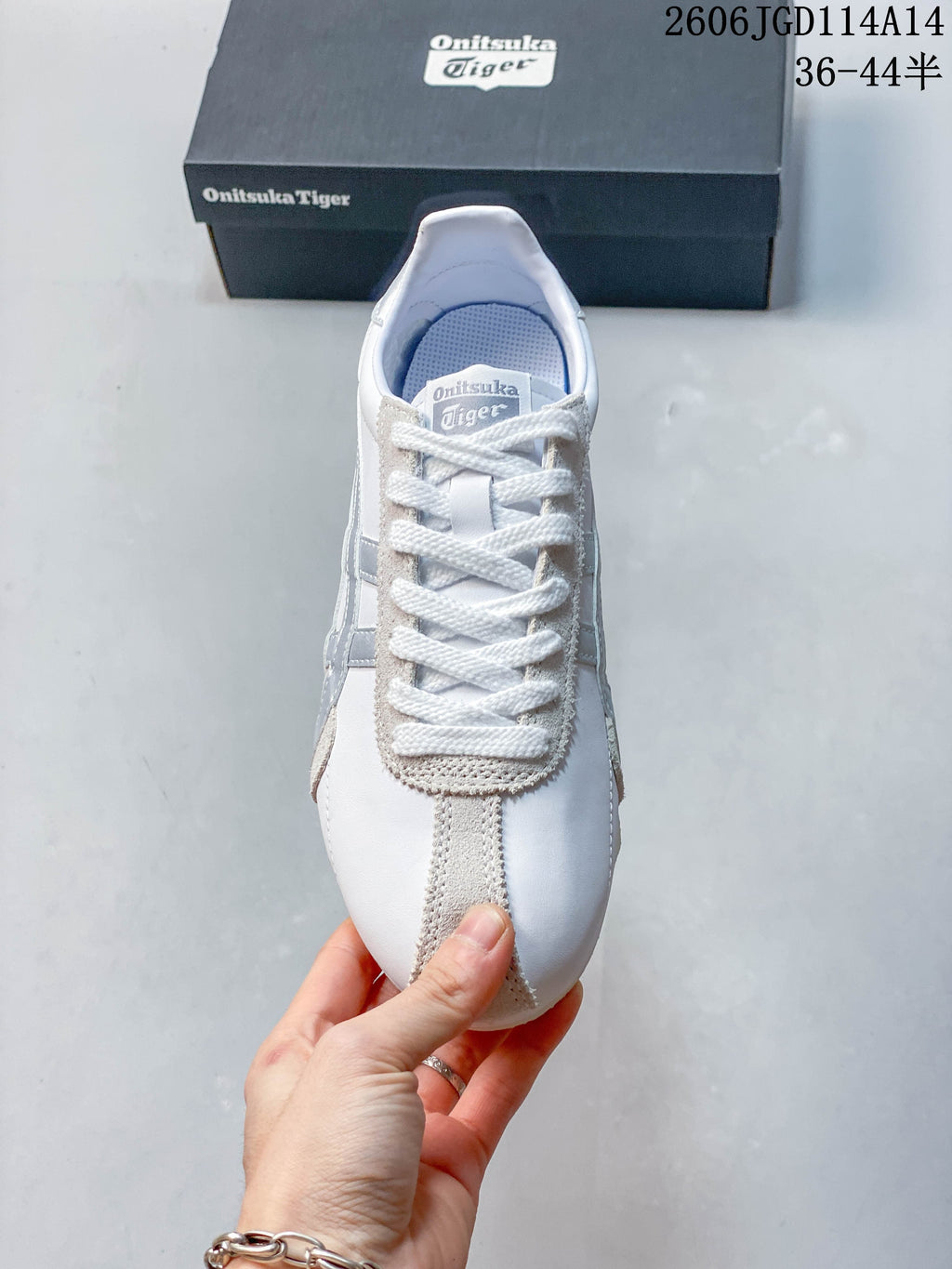 Top view of the white lace-up sneaker with silver side details