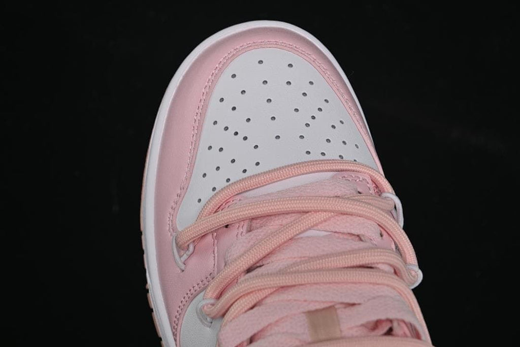 Top view of the perforated white toe and pink lacing.