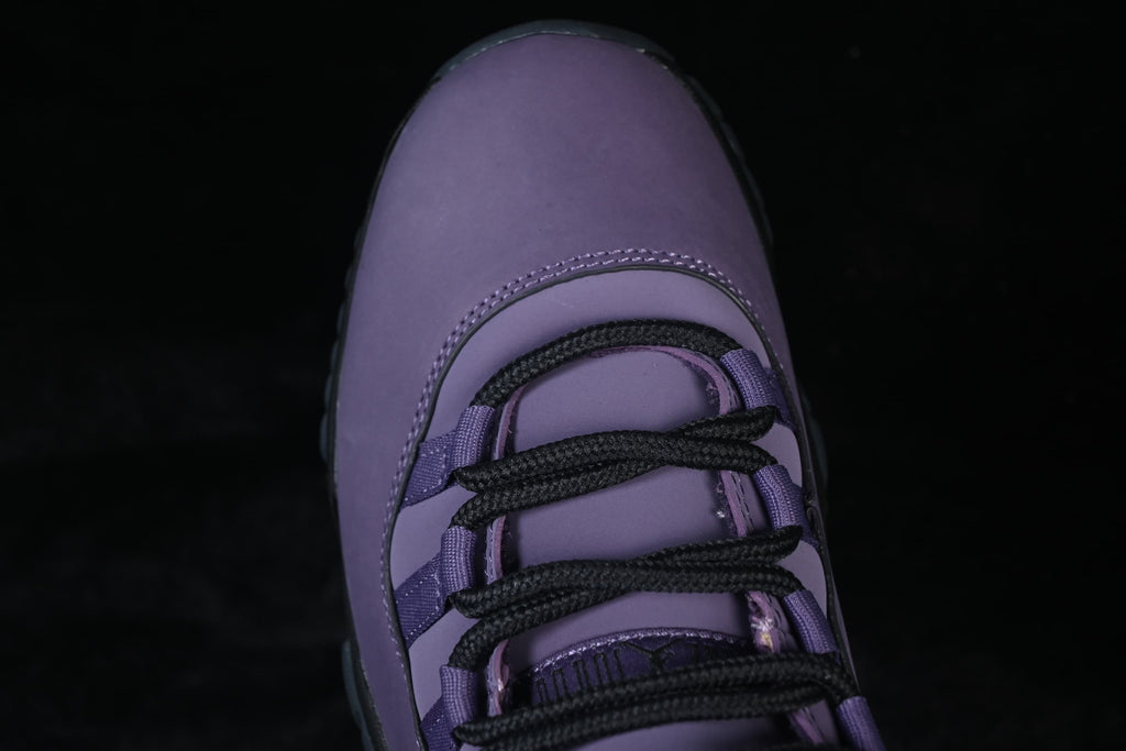 Close-up of the purple toe and black laces.