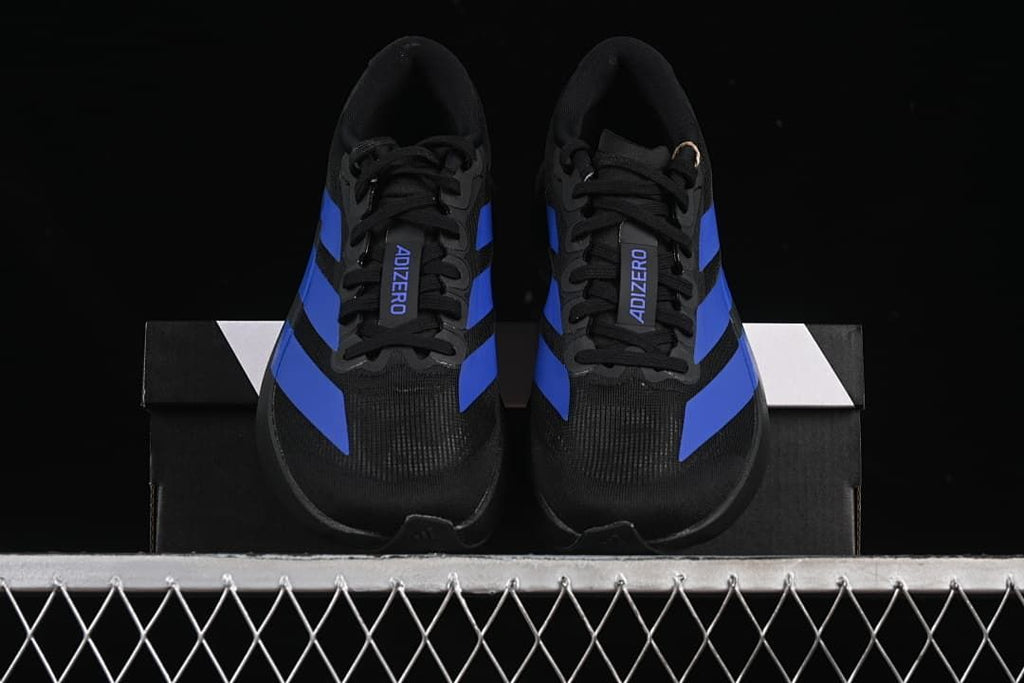 Front view of the pair showing black uppers and blue stripes.