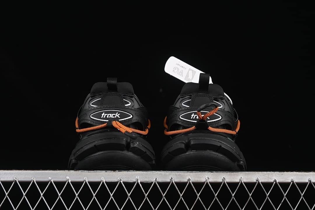 Rear view of the pair showing heel details and Track branding.