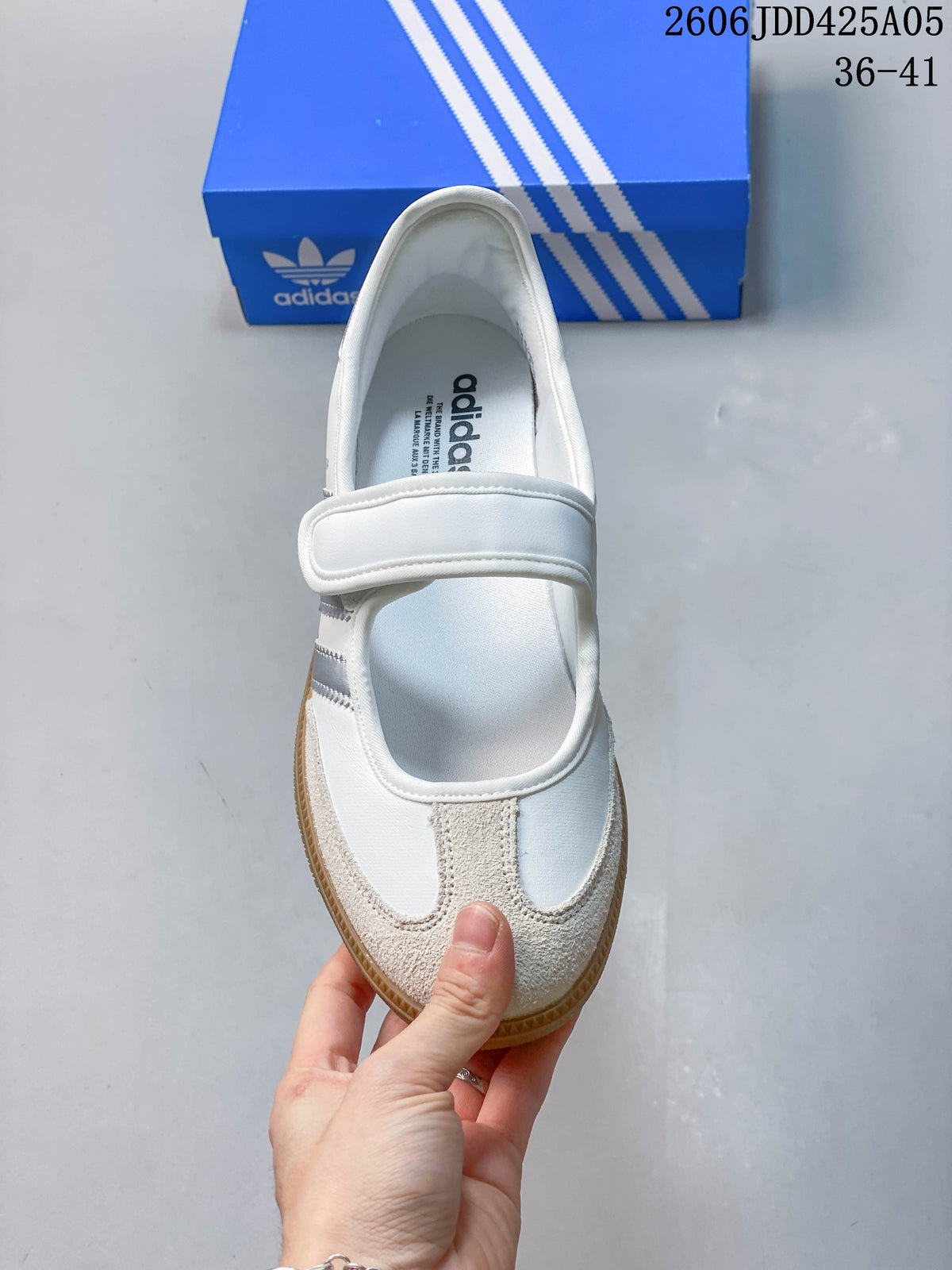 Top view of the sneaker with a hook-and-loop strap and light-colored toe overlay