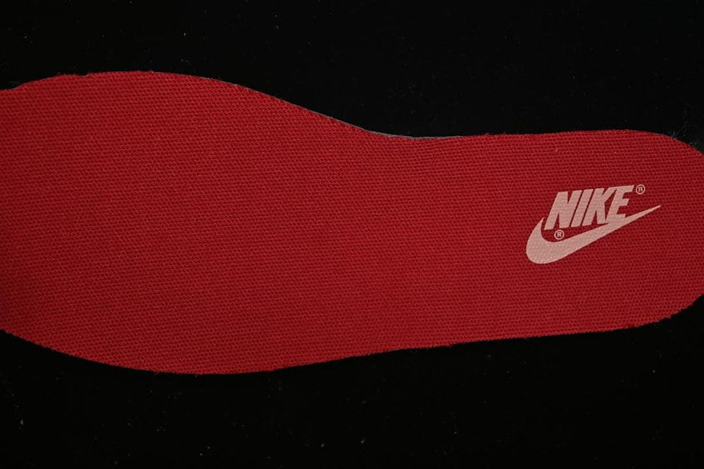 Red insole with a Nike logo.