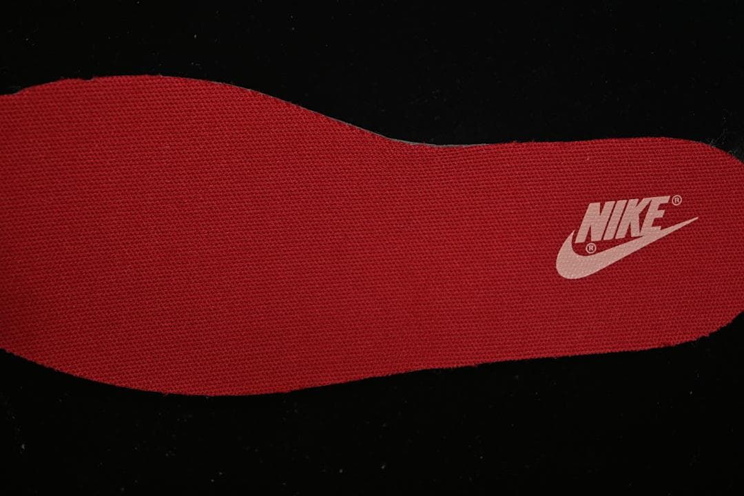 Red insole with a Nike logo.