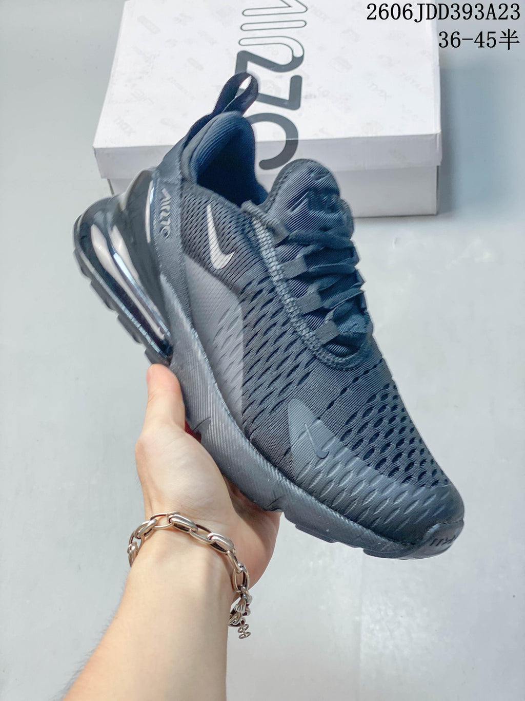 Angled side view of a dark gray Nike Air Max 270 sneaker