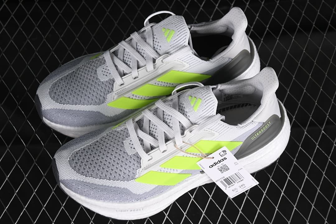 Pair of gray and white Ultraboost 5X shoes with lime accents.