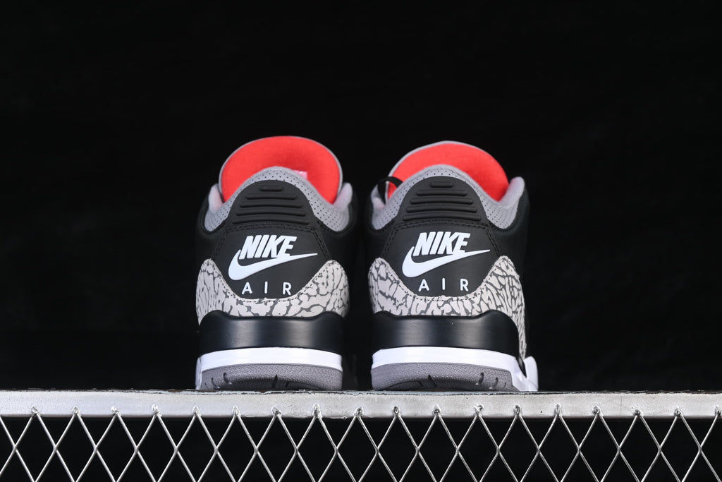 Rear view of both sneakers with cement-pattern heel overlays