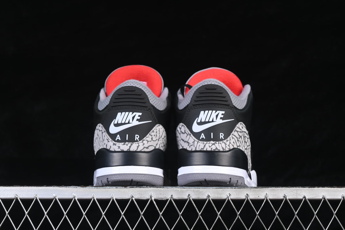 Rear view of both sneakers with cement-pattern heel overlays