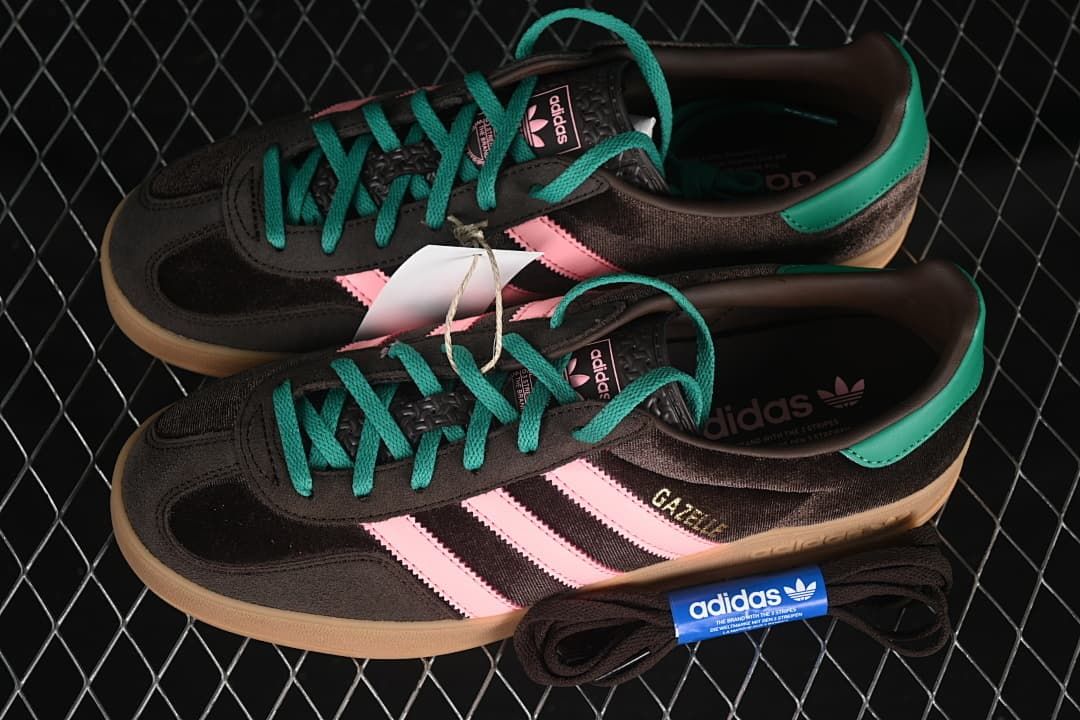 Pair of brown, pink, and teal Gazelle Indoor sneakers displayed with an extra set of dark laces.