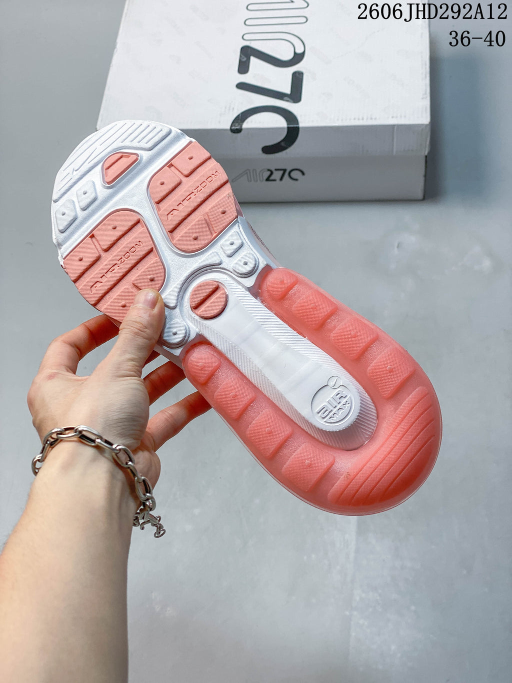 Close-up of the Nike Air Max 270 outsole with coral and white sections