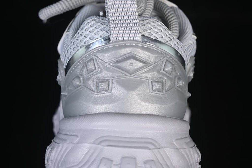 Rear close-up showing the sneaker’s heel and pull tab