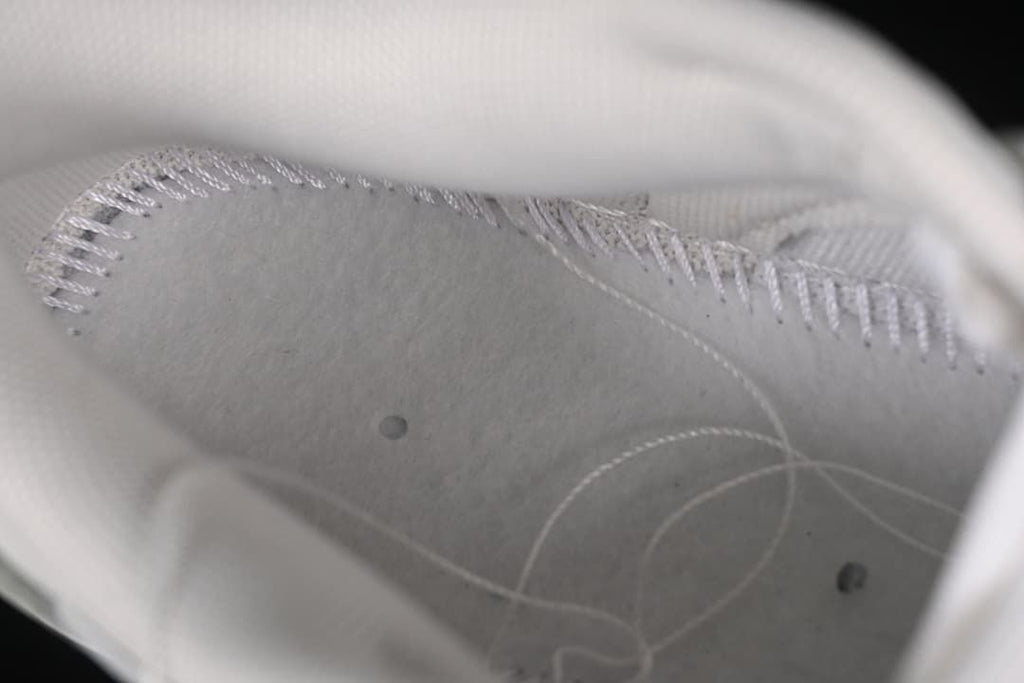 Close-up inside the shoe showing stitching and lining