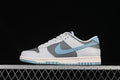 Side view of grey, white, and light blue Nike SB Dunk Low sneakers