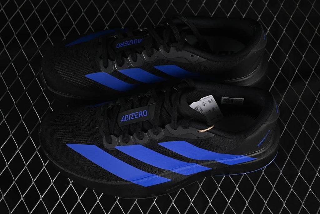 Pair of black and blue Adizero Evo SL running shoes.