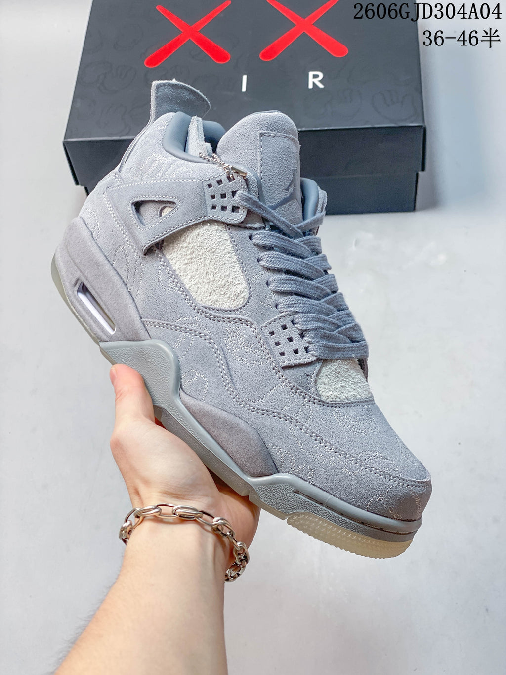 Angled close-up of the grey sneaker upper and side details